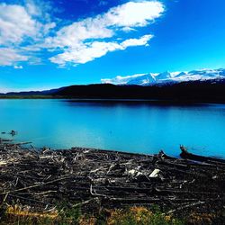 Scenic view of lake against blue sky