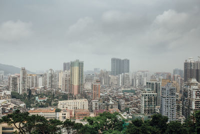 Buildings in city against sky