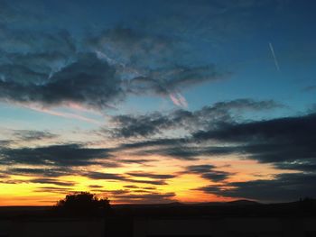 Scenic view of silhouette landscape against sky at sunset