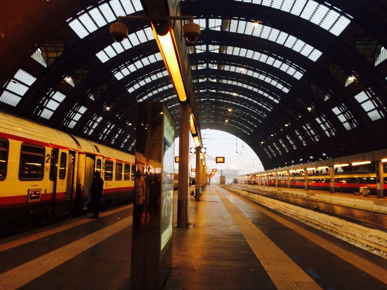 transportation, public transportation, railroad station, indoors, railroad station platform, rail transportation, railroad track, train - vehicle, architecture, mode of transport, passenger train, travel, built structure, subway station, ceiling, train, transportation building - type of building, public transport, illuminated, the way forward