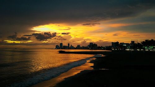 Scenic view of beach at sunset