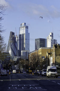 Buildings in city against sky