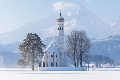 View of church on snow covered landscape