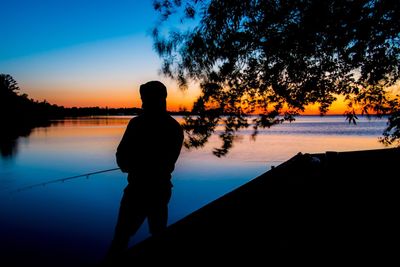 Scenic view of lake at sunset