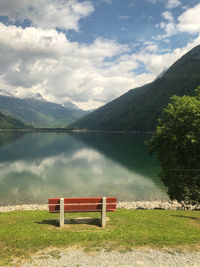 Scenic view of lake and mountains against sky
