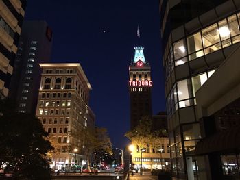 Low angle view of modern building at night