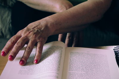 Close-up of hand holding book