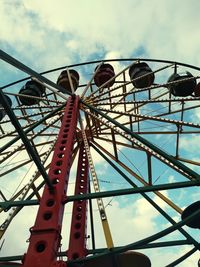 Low angle view of ferris wheel against sky