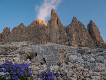 Low angle view of rock formations against sky
