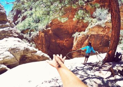 Woman standing on rock formation