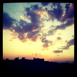 Scenic view of dramatic sky at sunset