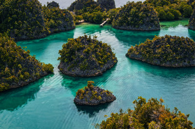 High angle view of rocks in sea