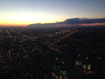 Aerial view of city during sunset