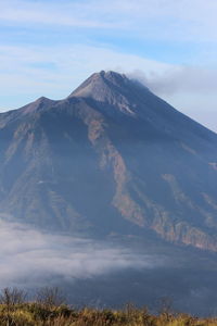 Scenic view of volcanic mountain against sky