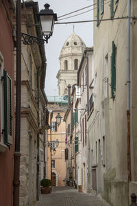 Narrow street amidst buildings in town