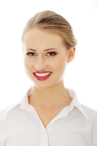 Portrait of a smiling young woman over white background