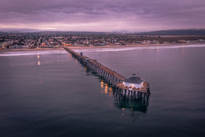 Imperial beach pier in san diego at sunset. drone photo.