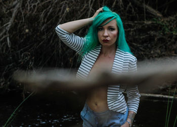 Young woman looking at lake