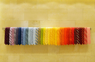 Various neckties hanging on rack in store