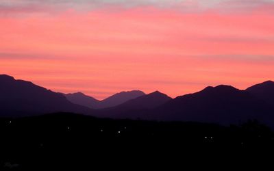 Scenic view of mountains at sunset