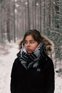 Portrait of teenage girl in snow