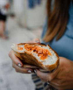 Midsection of woman holding food