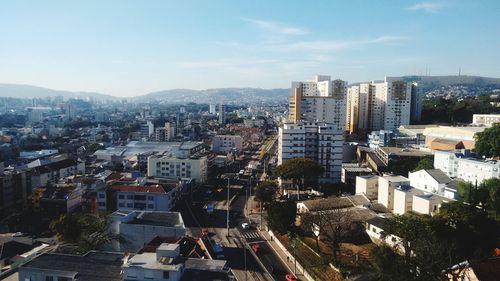 High angle view of buildings in city against sky