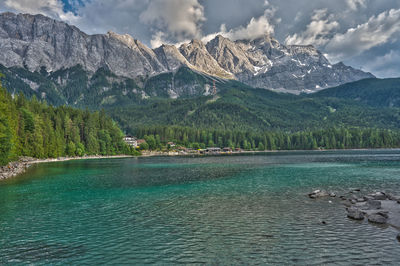 Scenic view of lake and mountains against sky