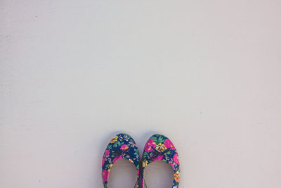 Directly above shot of shoes at beach