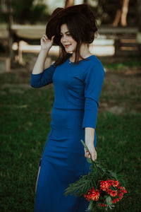 Young woman standing on field