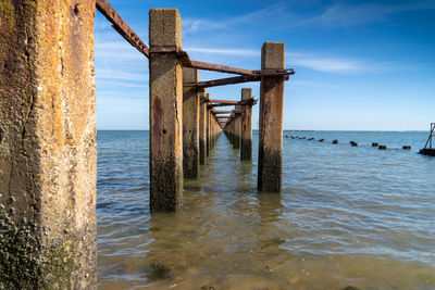 Pier over sea against sky