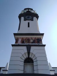 Low angle view of clock tower against sky