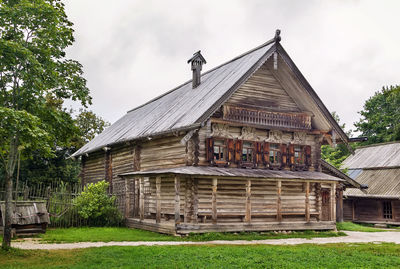 Exterior of house by building against sky