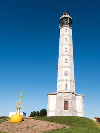 Low angle view of lighthouse against clear sky