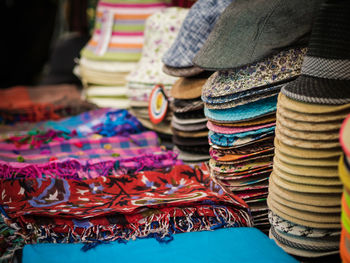 Various hats and headscarves for sale at market