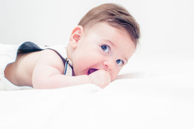 Portrait of cute baby girl over white background