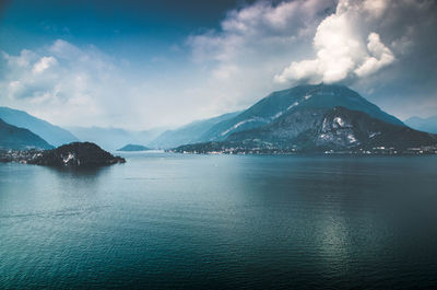 Scenic view of lake against sky during winter