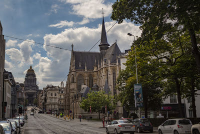 Street amidst buildings in city against sky