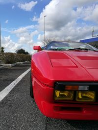 Car on road against sky in city