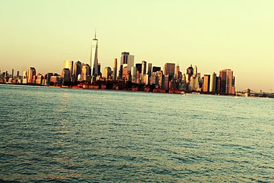 Panoramic view of sea and buildings against clear sky