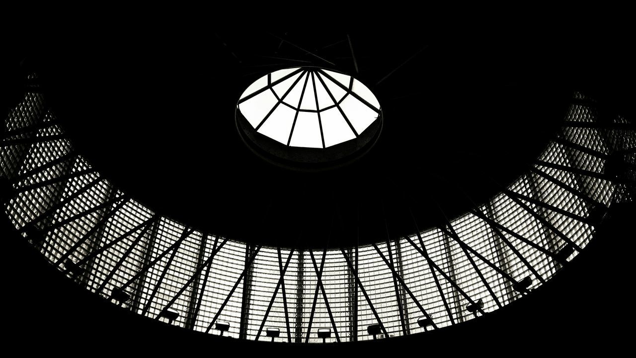 indoors, architecture, built structure, low angle view, pattern, skylight, ceiling, design, window, glass - material, geometric shape, architectural feature, stained glass, directly below, illuminated, circle, building, no people, modern, building exterior
