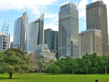 Modern buildings in city against sky