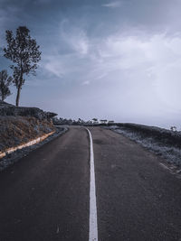 Surface level of empty road against sky