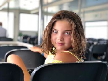 Portrait of girl sitting in bus