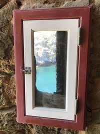 Reflection of trees on glass window