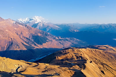 Scenic view of snowcapped mountains against sky