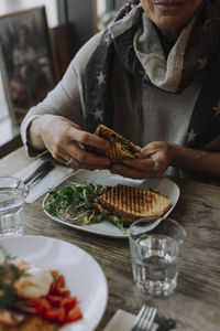 Midsection of man preparing food