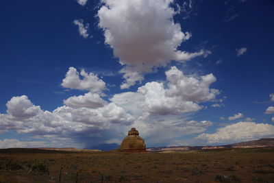 Rock formation at desert against sky