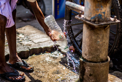 Low section of man working in water