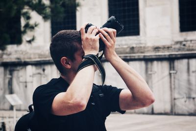 Midsection of man photographing